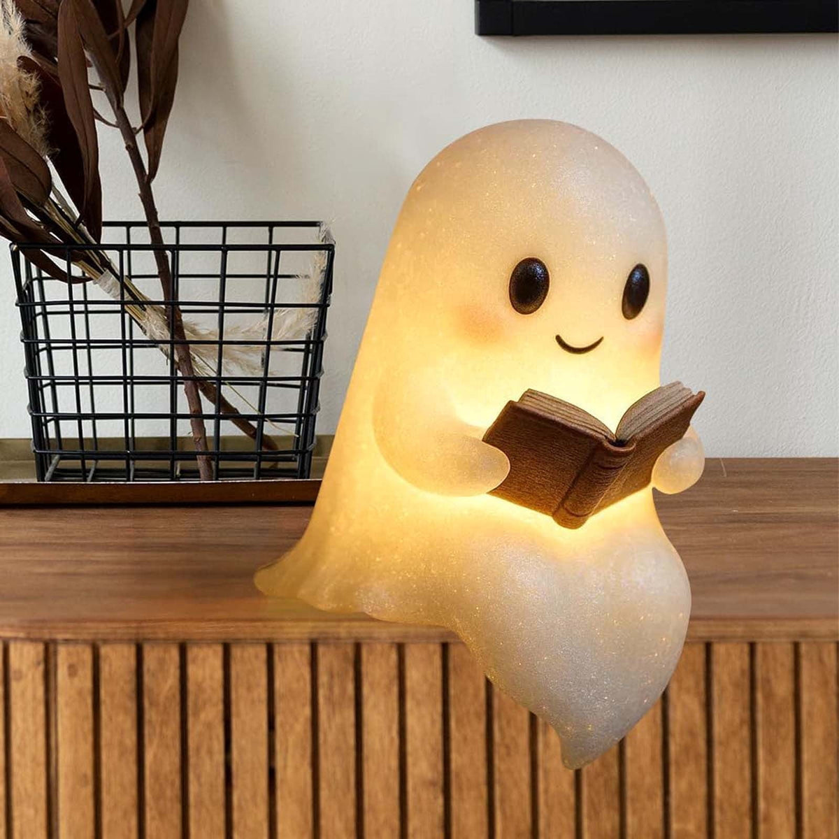 Cozy ghost lamp displayed on a wooden shelf